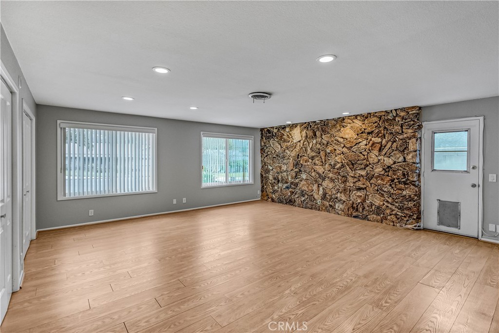 5544 Wentworth Drive Riverside, CA 92505 - Photo 9 of 29 wooden floor in an empty room with a window