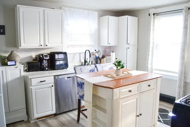 a kitchen with a sink and cabinets