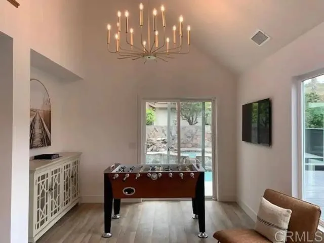 a bedroom with furniture and a window