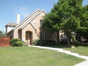 a view of backyard of house with green space