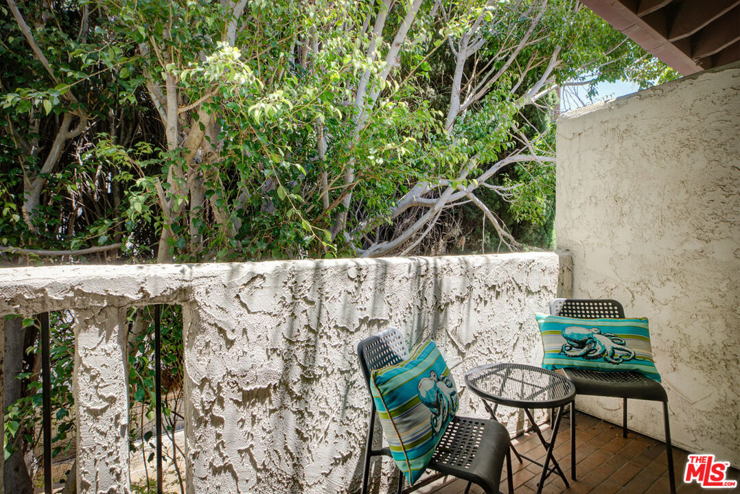 1916 Overland Avenue, Unit 2 Los Angeles, CA 90025 - Photo 12 of 17 a view of table and chairs in patio