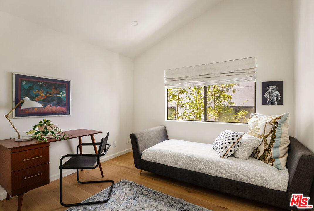 1916 Overland Avenue, Unit 2 Los Angeles, CA 90025 - Photo 16 of 17 a living room with furniture and a large window