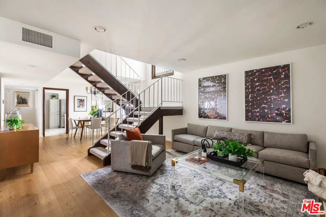 1916 Overland Avenue, Unit 2 Los Angeles, CA 90025 - Photo 3 of 17 a living room with furniture and wooden floor