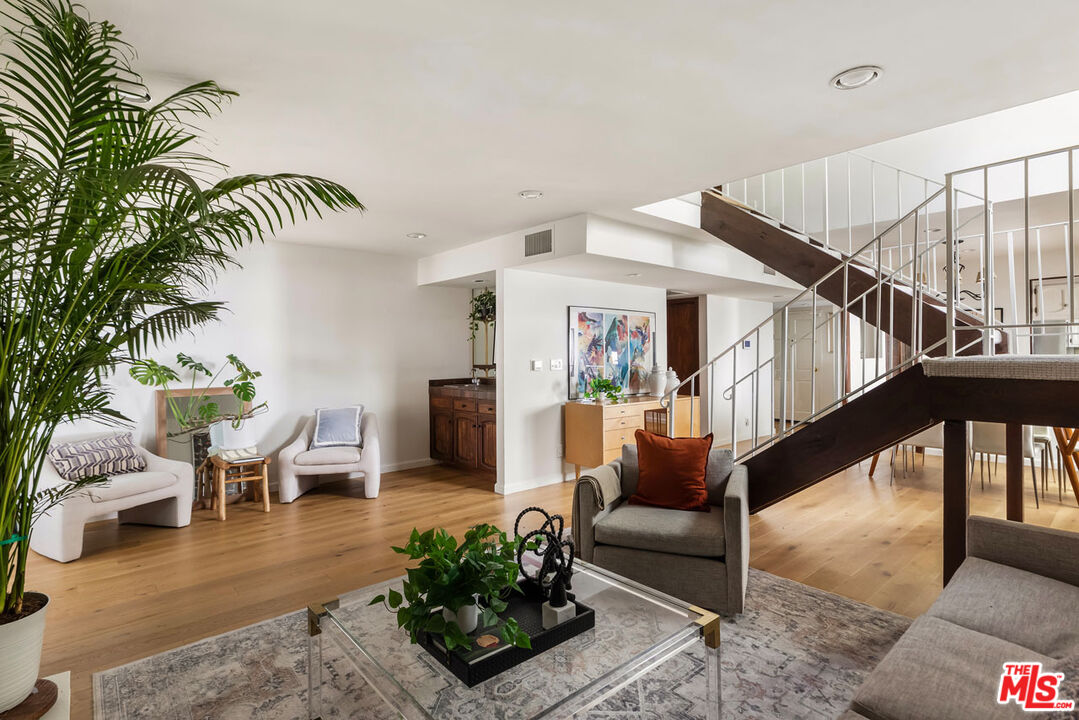 1916 Overland Avenue, Unit 2 Los Angeles, CA 90025 - Photo 4 of 17 a living room with furniture and a potted plant