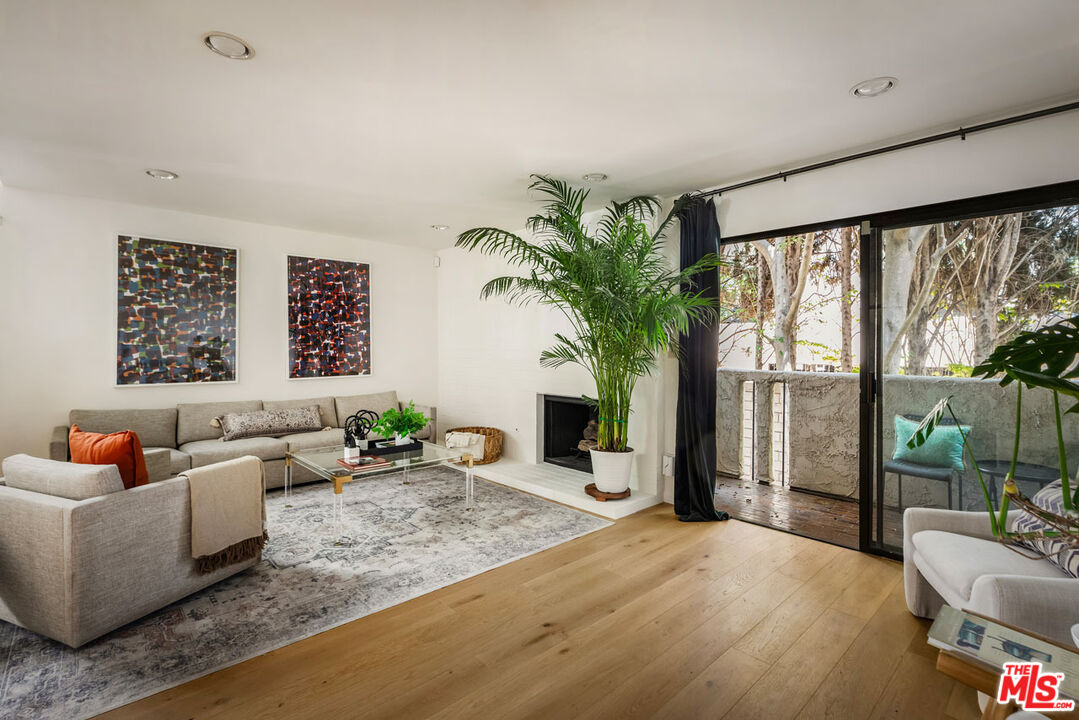 1916 Overland Avenue, Unit 2 Los Angeles, CA 90025 - Photo 5 of 17 a living room with furniture and a large window
