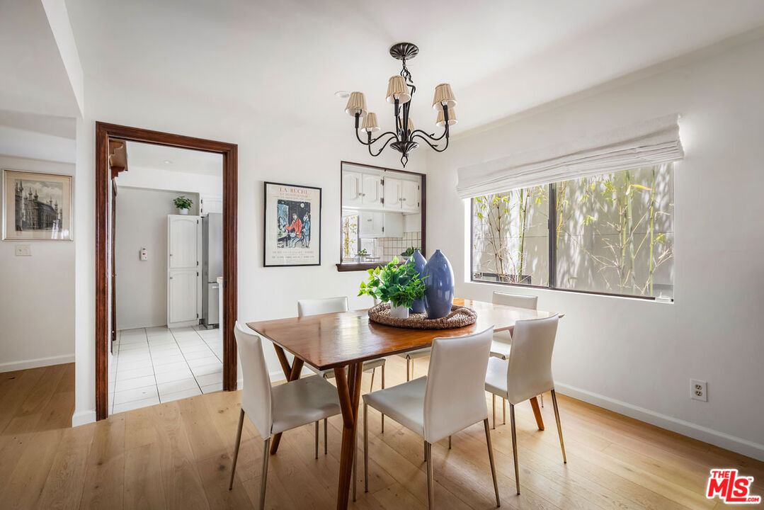 1916 Overland Avenue, Unit 2 Los Angeles, CA 90025 - Photo 7 of 17 a view of a dining room with furniture window and wooden floor