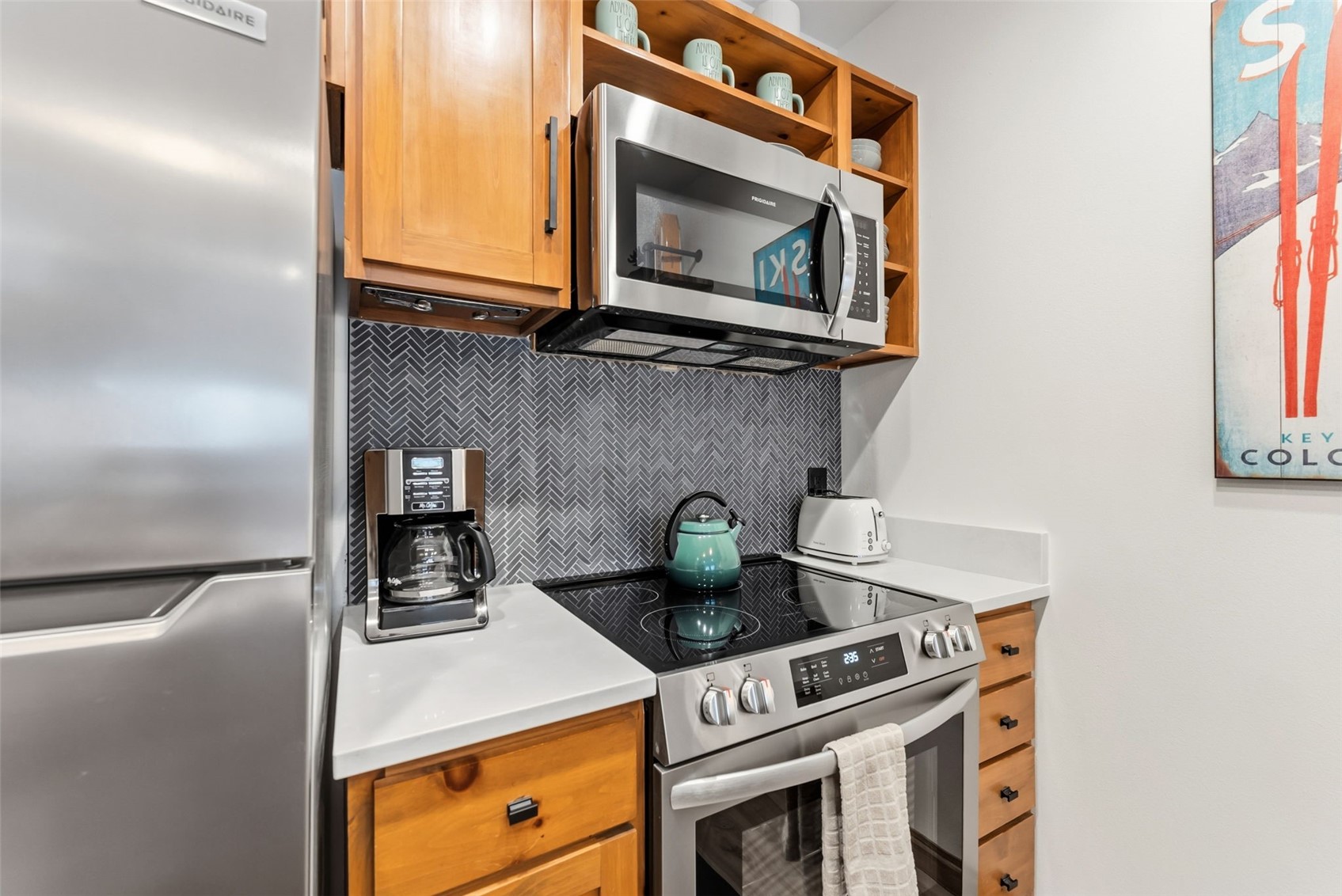 195 River Run Road, Unit 8015 Keystone, CO 80435 - Photo 12 of 35 a kitchen with a stove and a microwave