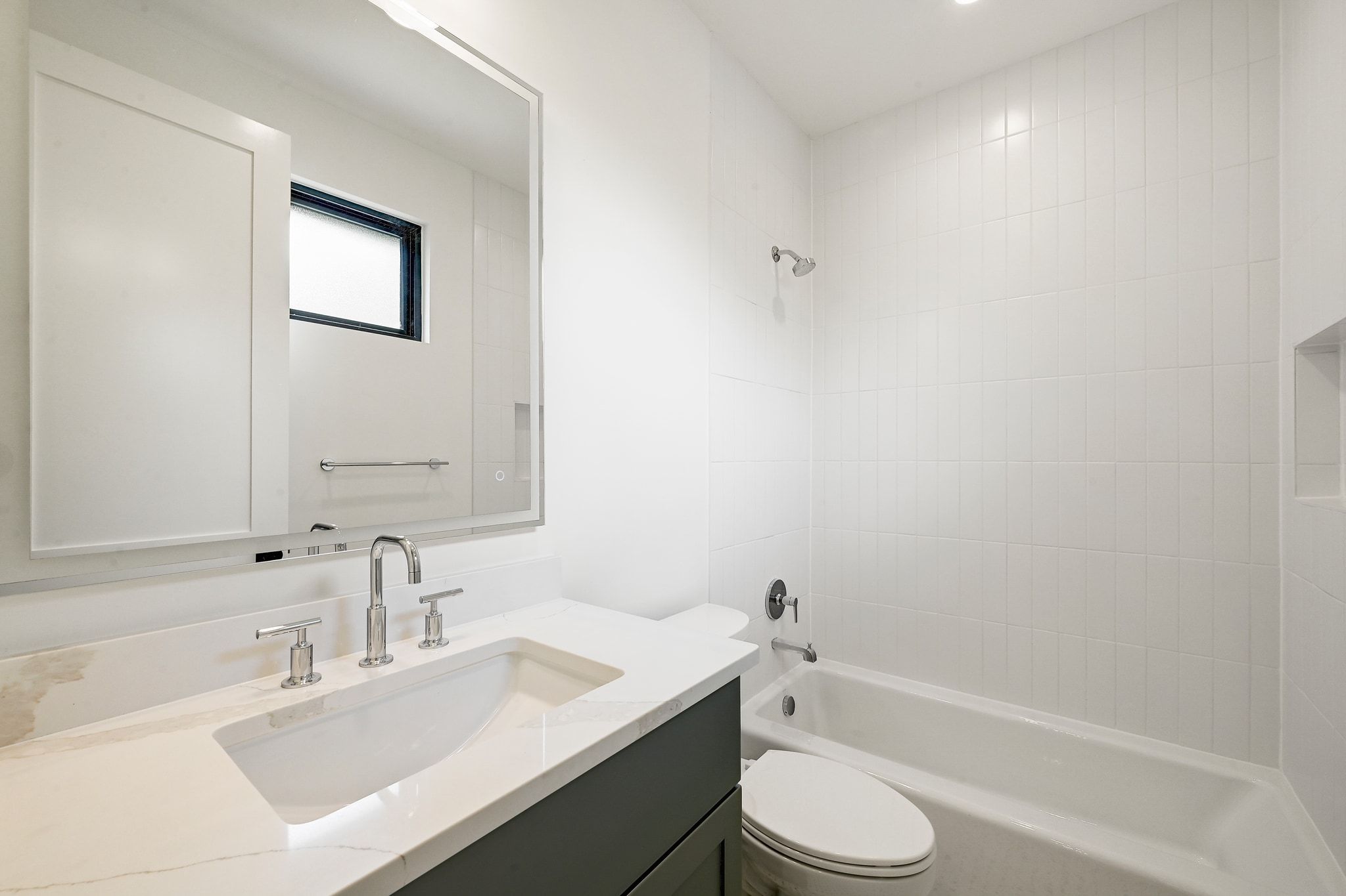 1705 Cullen Avenue Austin, TX 78757 - Photo 21 of 35 a bathroom with a sink toilet vanity and bathtub