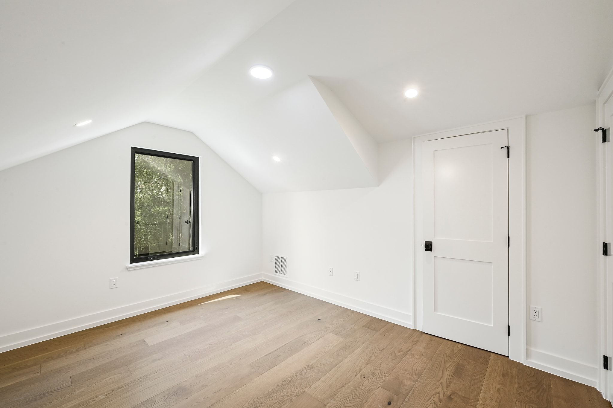 1705 Cullen Avenue Austin, TX 78757 - Photo 25 of 35 an empty room with wooden floor and windows