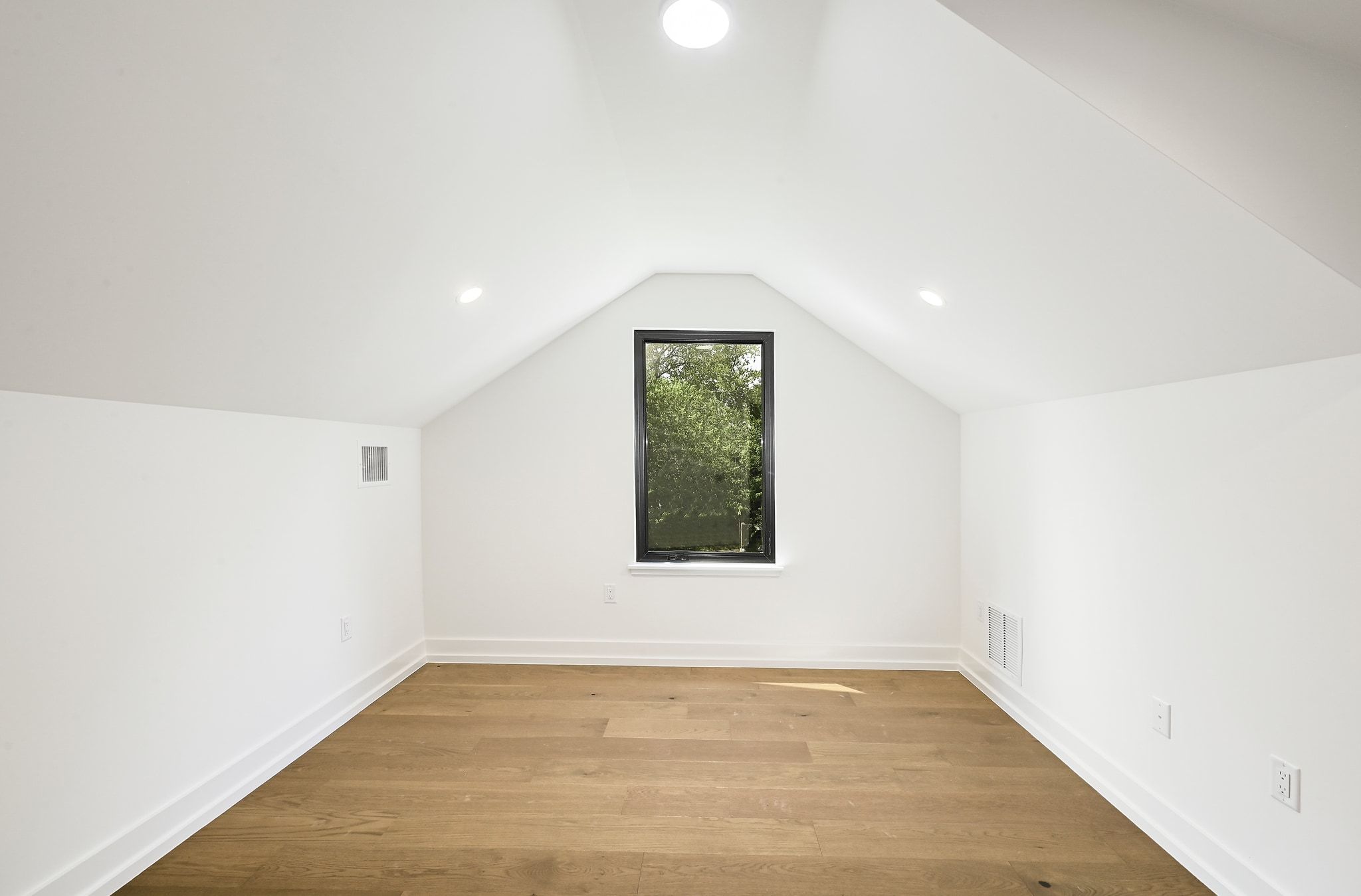 1705 Cullen Avenue Austin, TX 78757 - Photo 26 of 35 a view of an empty room with wooden floor and a window