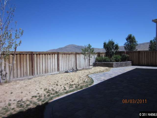 11109 Messina Way Reno, NV 89521 - Photo 11 of 11 a view of backyard with wooden fence