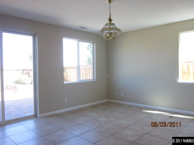 11109 Messina Way Reno, NV 89521 - Photo 4 of 11 a view of a chandelier in a room and a window
