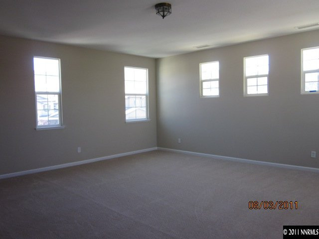 11109 Messina Way Reno, NV 89521 - Photo 9 of 11 a view of an empty room with windows