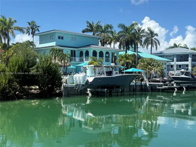 a view of a house with a yard porch and sitting area