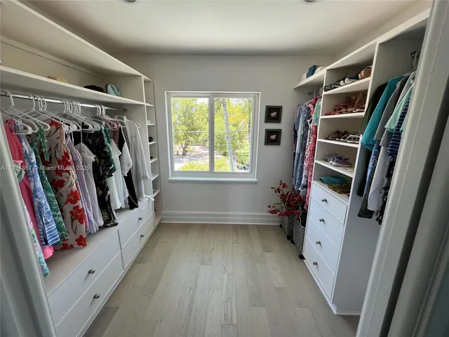 a bedroom with furniture and a window