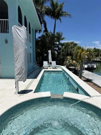 a view of backyard with a garden and outdoor seating
