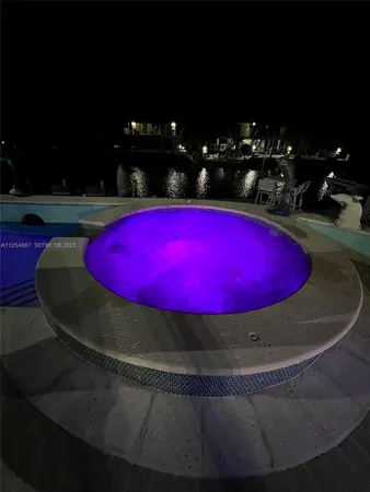 a view of a pool with chairs
