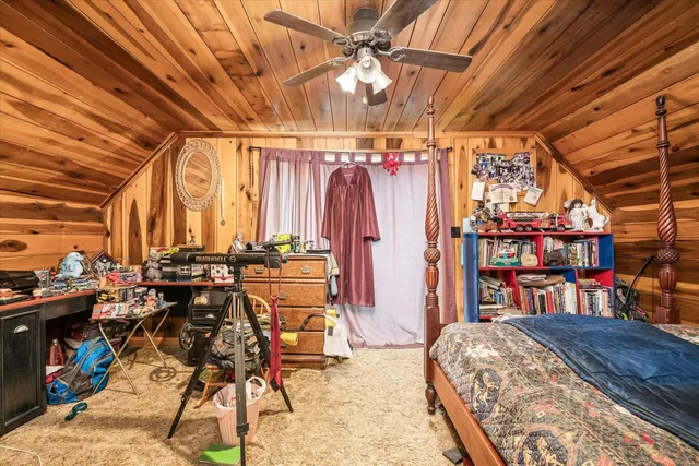 a bed room with a bed and a table