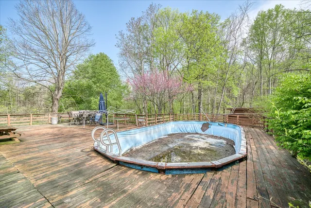 a view of a swimming pool with a patio