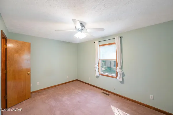 wooden floor in an empty room and a window