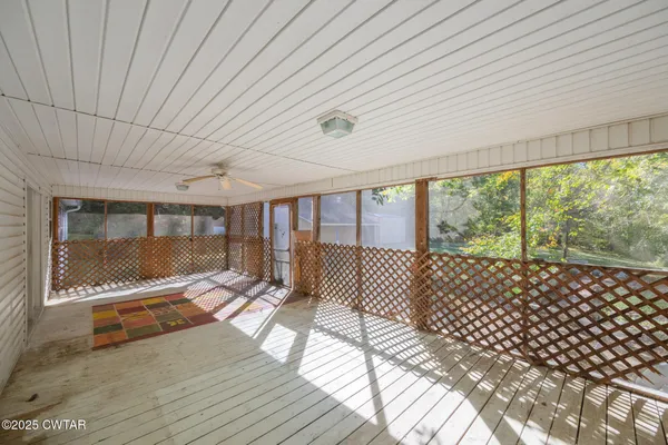 a front view of a house with yard patio and green space