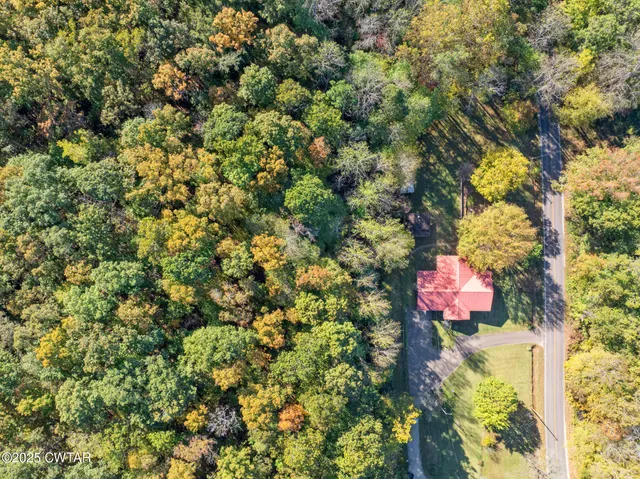 a view of a house with a tree