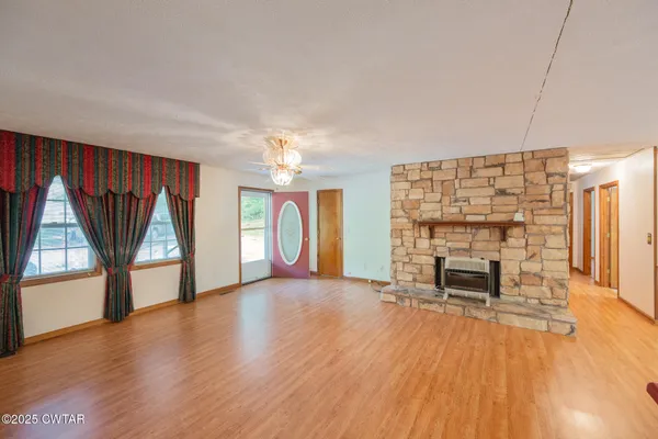 a kitchen with stainless steel appliances granite countertop a sink stove and wooden cabinets