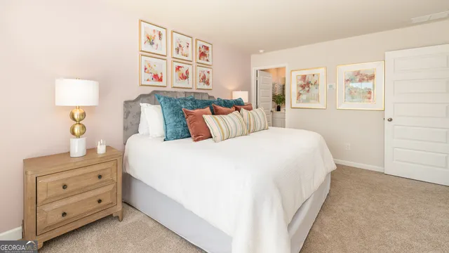 a bedroom with a bed and a night stand