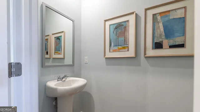 a bathroom with a sink and mirror