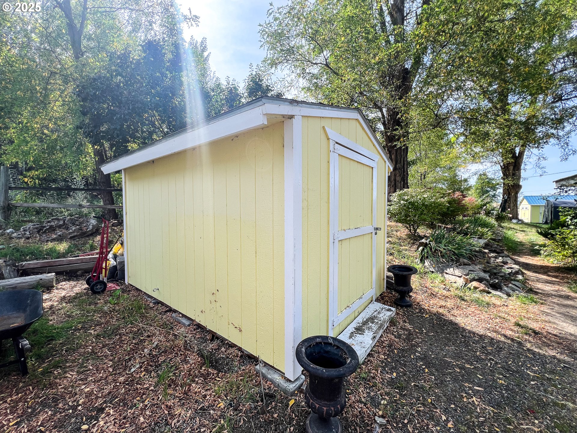 59920 Highway 26 John Day, OR 97845 - Photo 15 of 35 a view of a backyard with plants and a fire pit