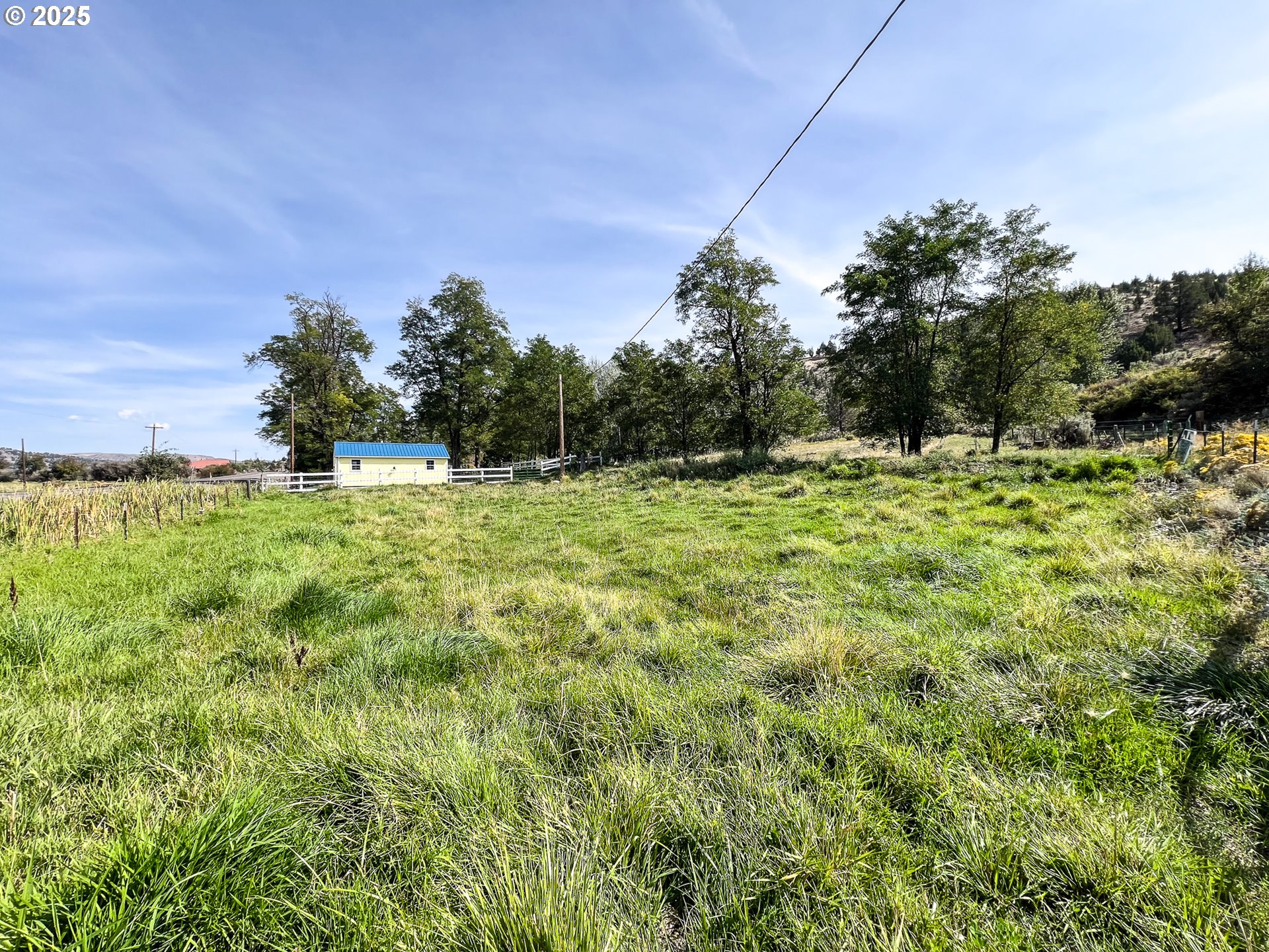 59920 Highway 26 John Day, OR 97845 - Photo 25 of 35 a backyard of a house with lots of green space