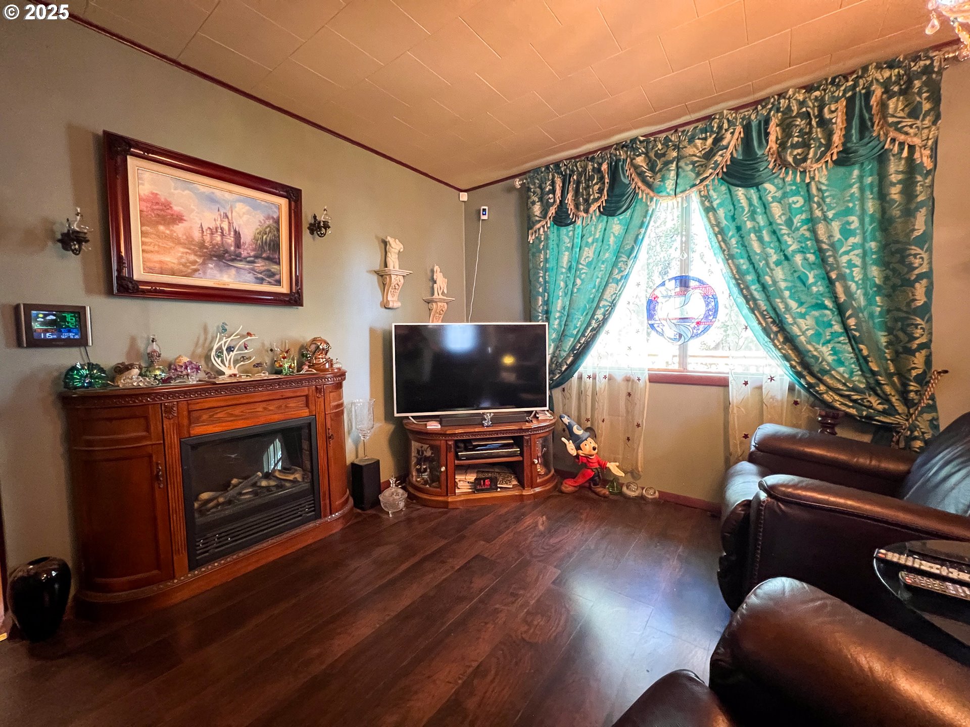 59920 Highway 26 John Day, OR 97845 - Photo 5 of 35 a living room with furniture a flat screen tv and a fireplace