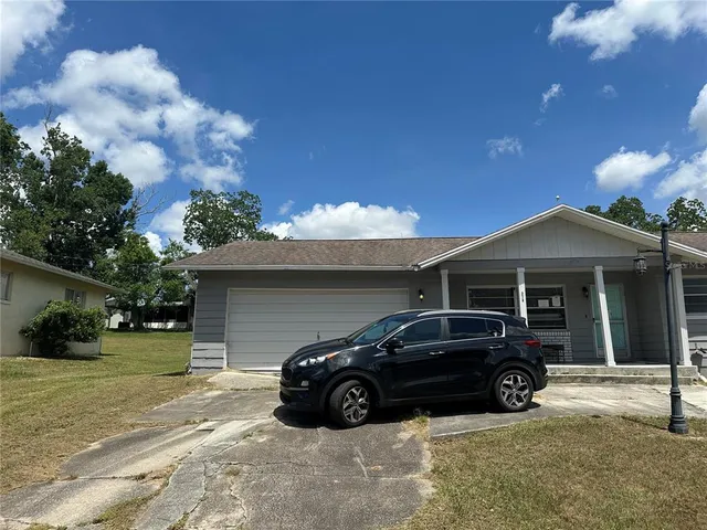 a car parked in front of a house