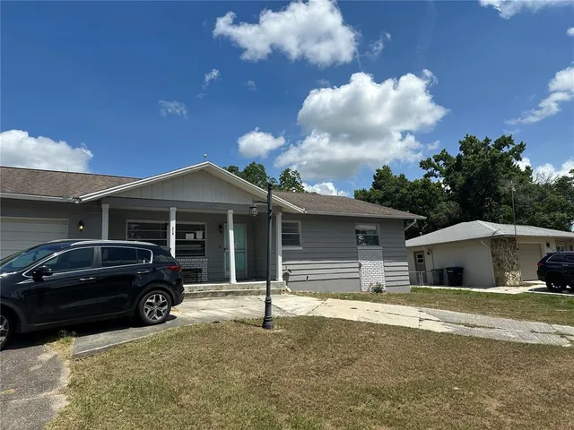 a house view with a garden space