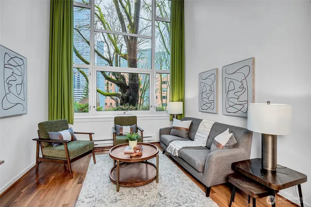 a living room with furniture and a lamp