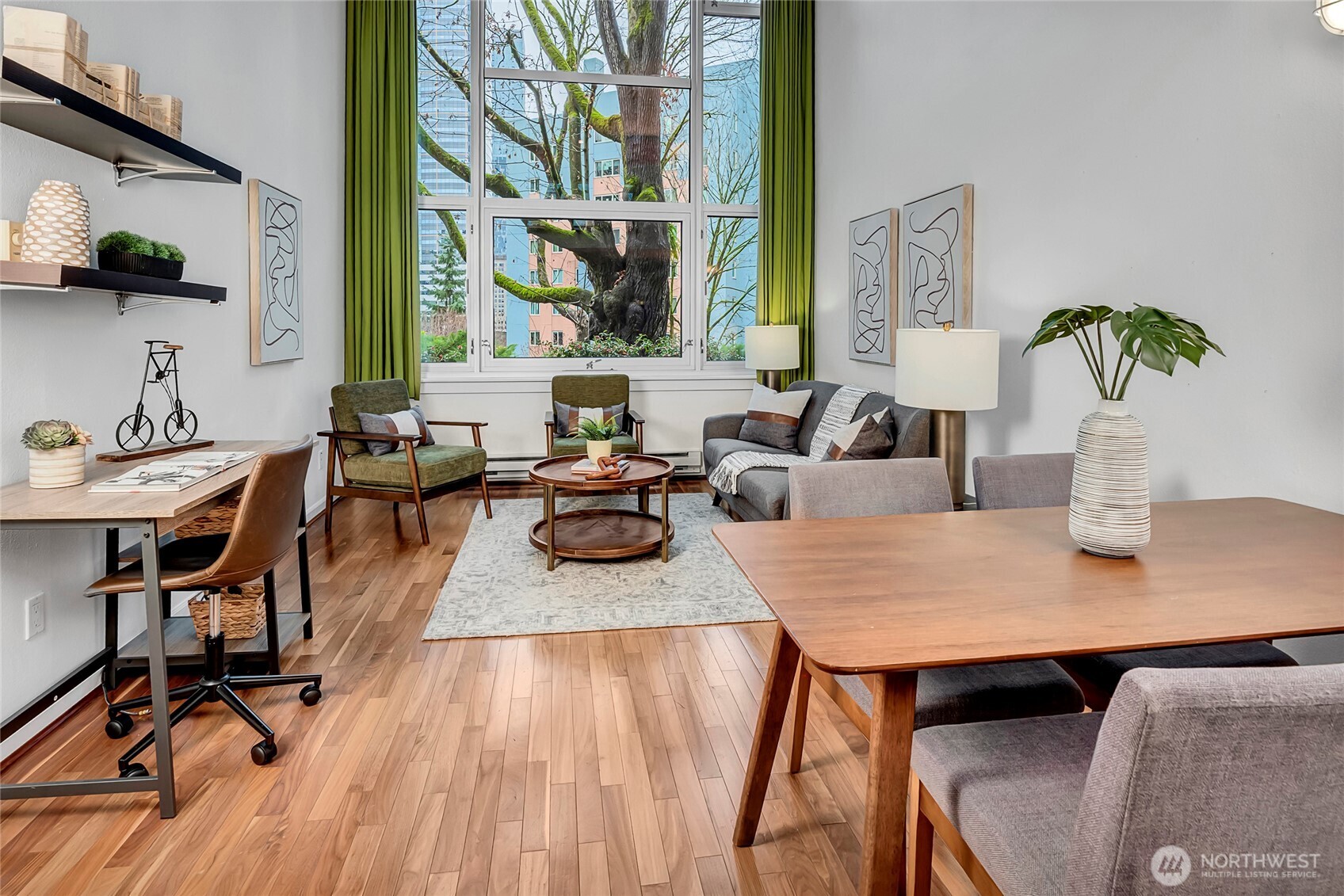 1000 Union Street, Unit 202 Seattle, WA 98101 - Photo 13 of 30 a view of a dining room with furniture and wooden floor