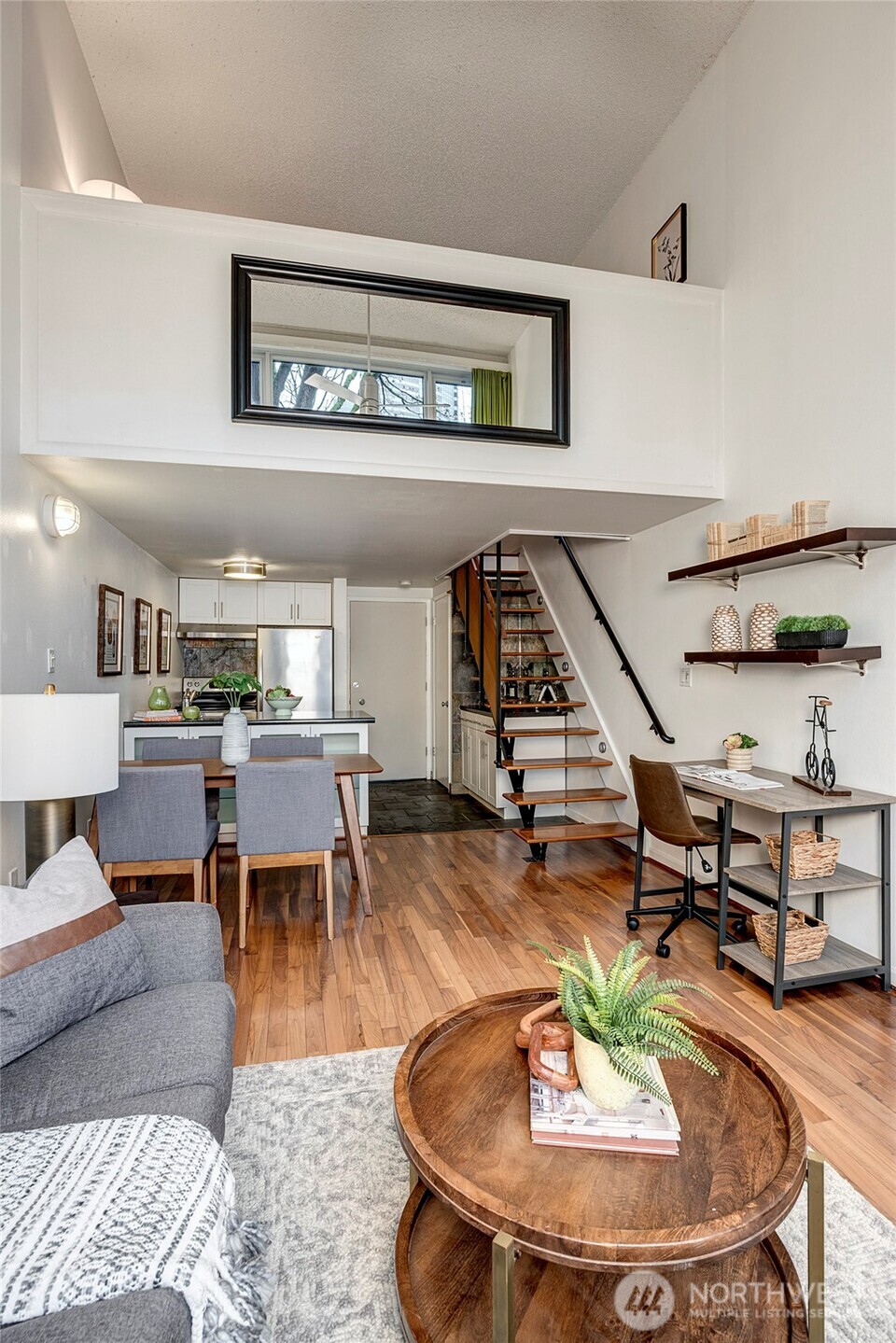 1000 Union Street, Unit 202 Seattle, WA 98101 - Photo 16 of 30 a living room with furniture and view of kitchen