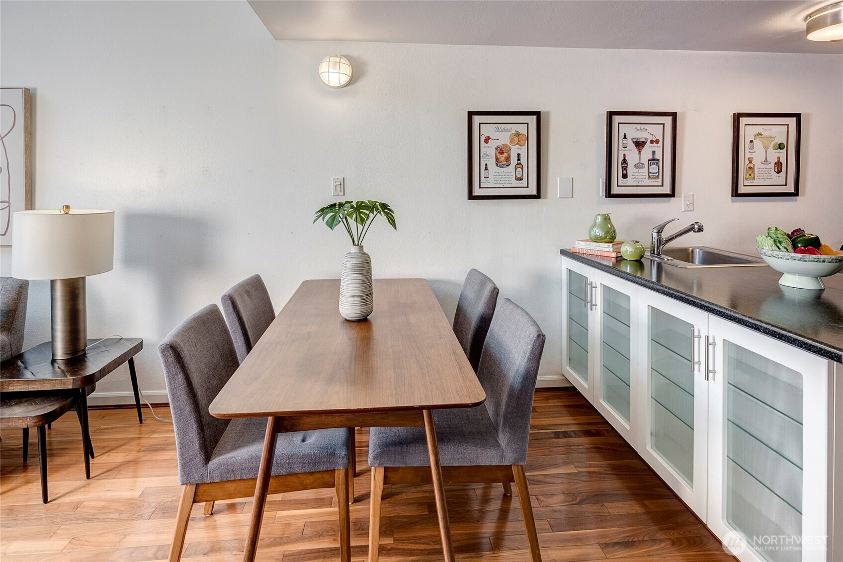 1000 Union Street, Unit 202 Seattle, WA 98101 - Photo 19 of 30 a view of a dining room with furniture and wooden floor