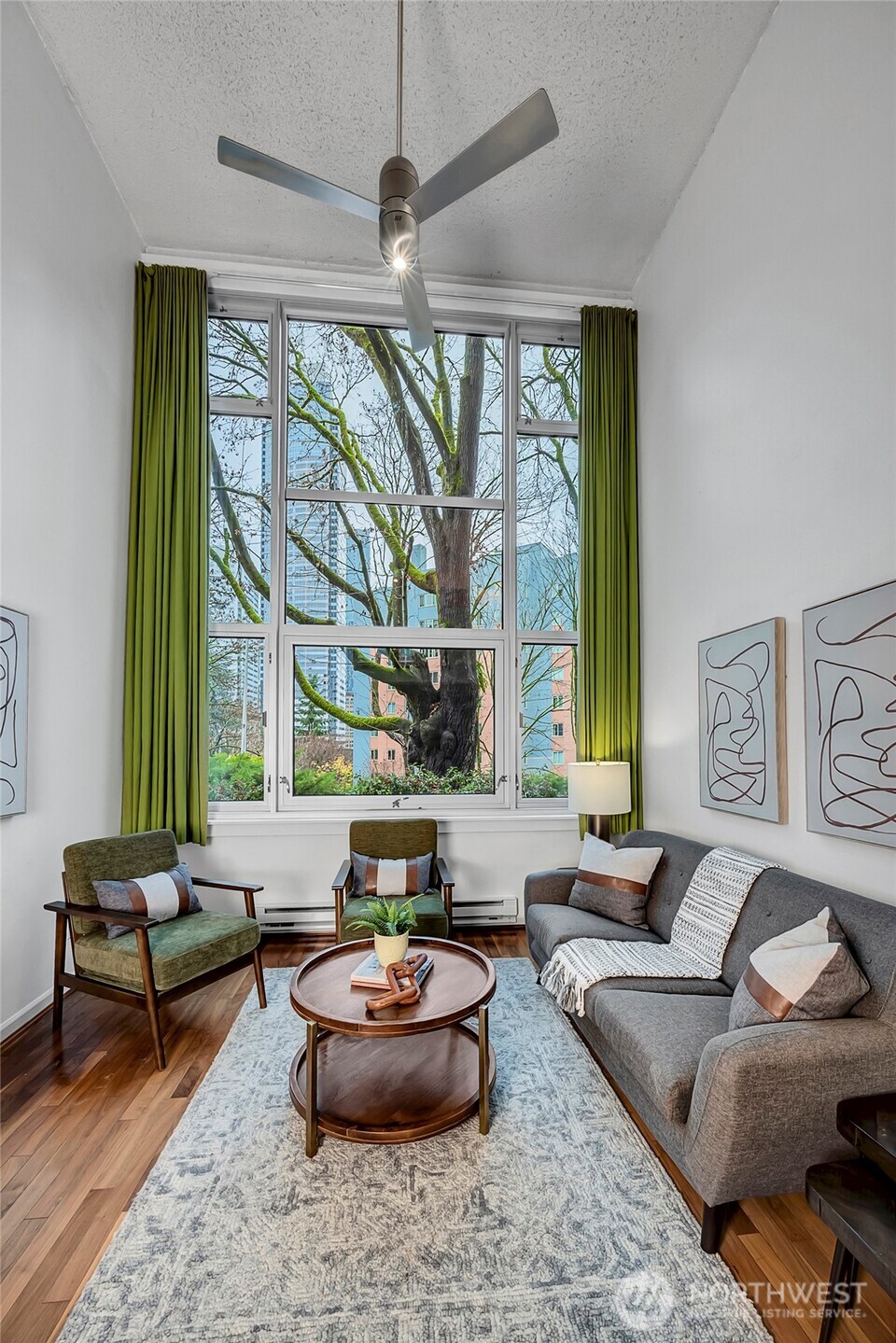 1000 Union Street, Unit 202 Seattle, WA 98101 - Photo 20 of 30 a living room with furniture and a large window
