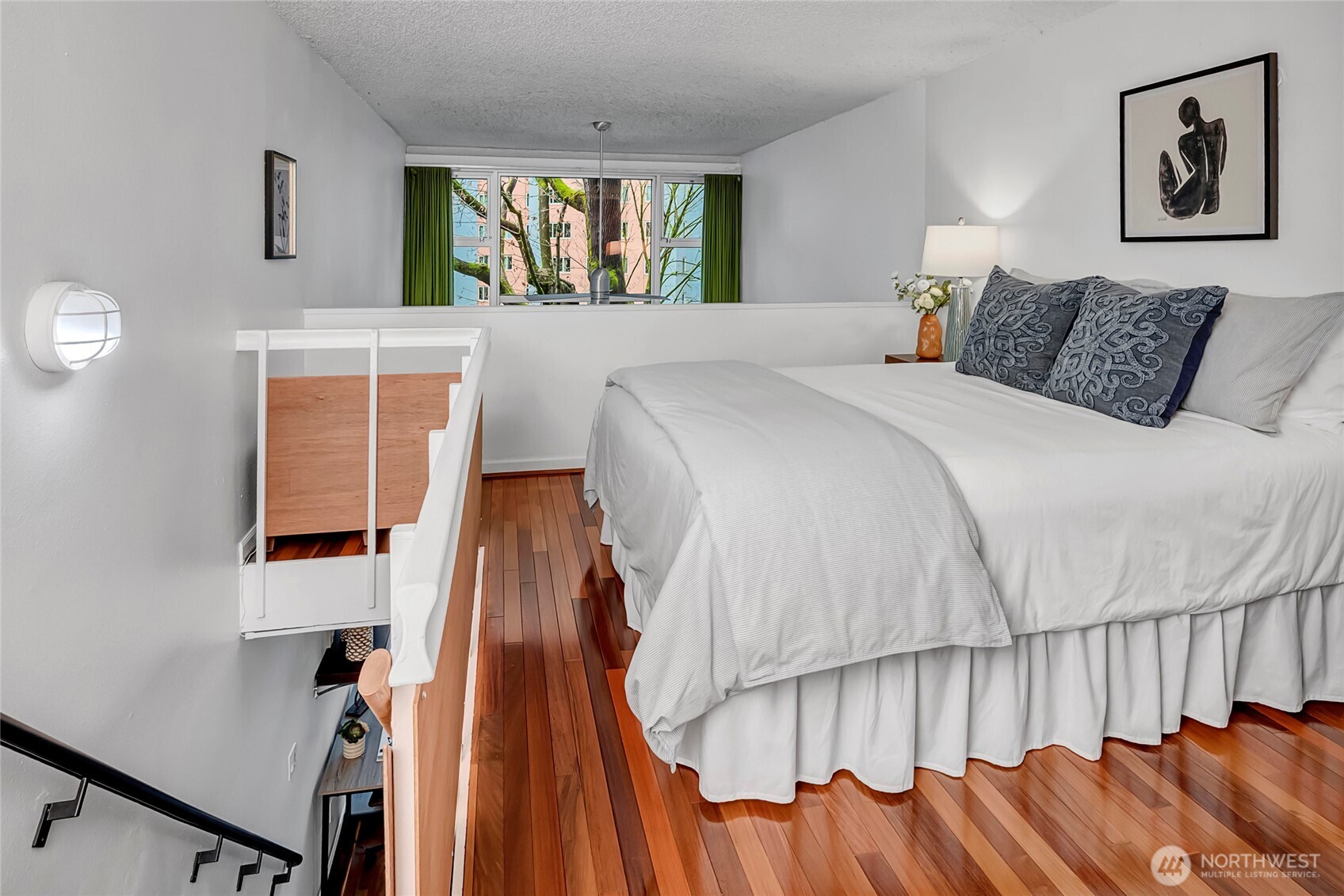1000 Union Street, Unit 202 Seattle, WA 98101 - Photo 23 of 30 a bedroom with a bed and a window