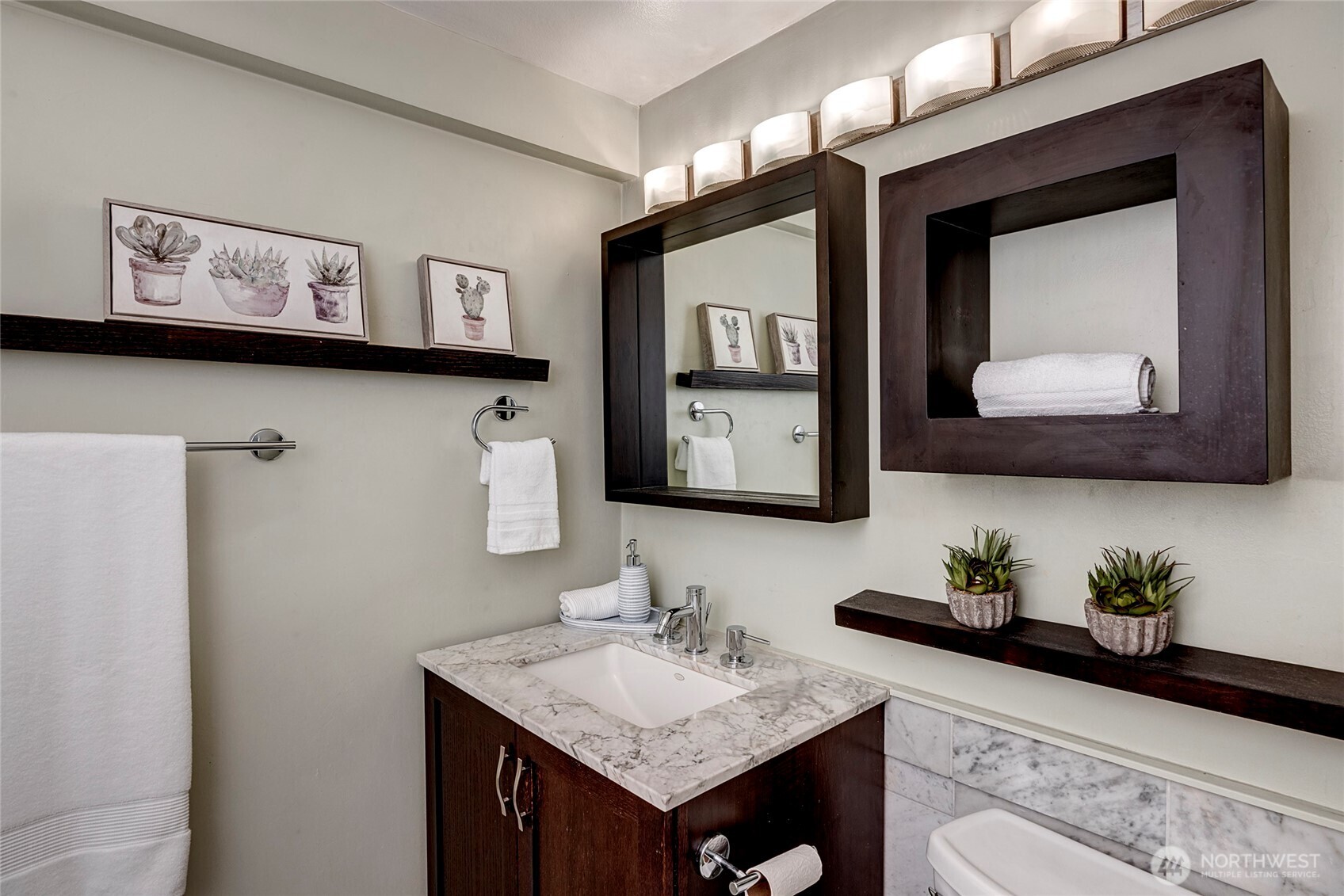 1000 Union Street, Unit 202 Seattle, WA 98101 - Photo 26 of 30 a bathroom with a sink and a mirror