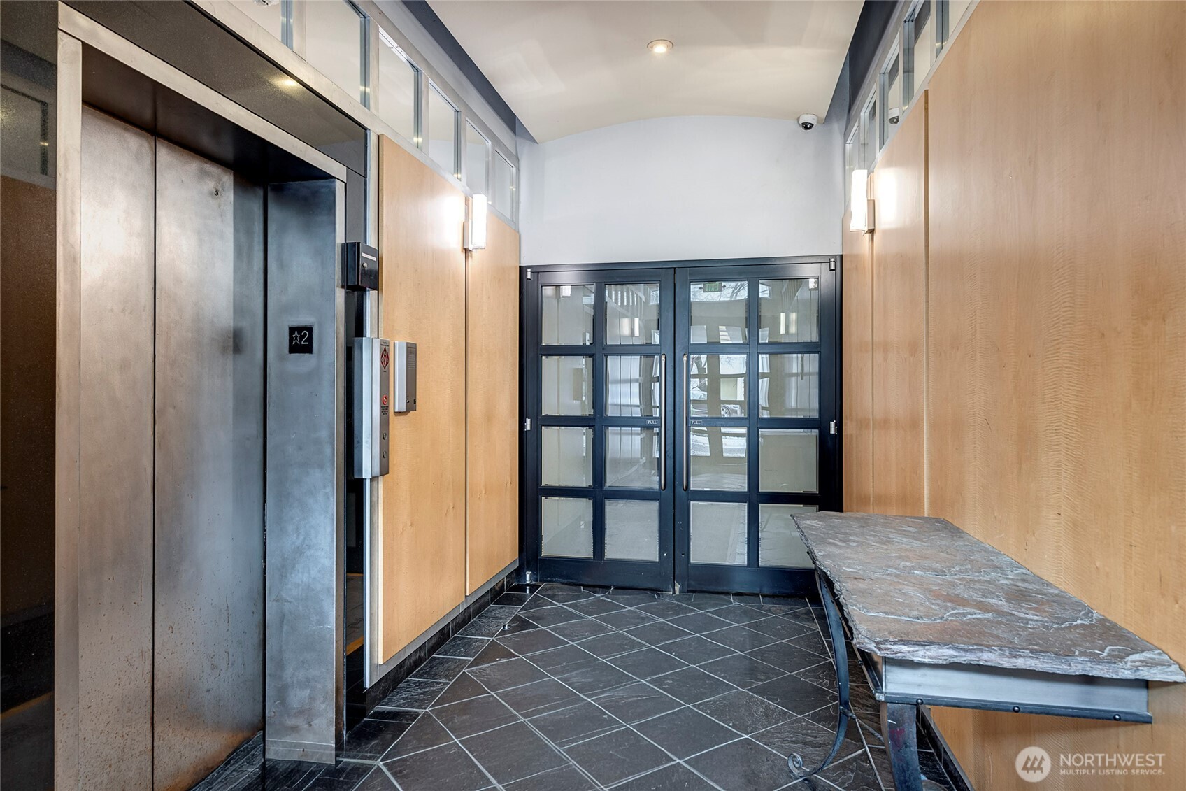 1000 Union Street, Unit 202 Seattle, WA 98101 - Photo 5 of 30 a view of a hallway and an entryway