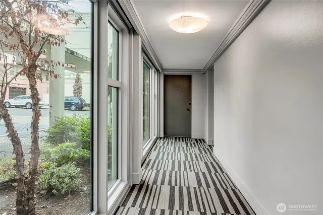 a view of balcony with wooden floor