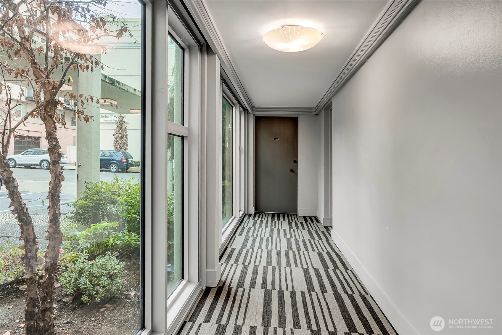1000 Union Street, Unit 202 Seattle, WA 98101 - Photo 6 of 30 a view of balcony with wooden floor