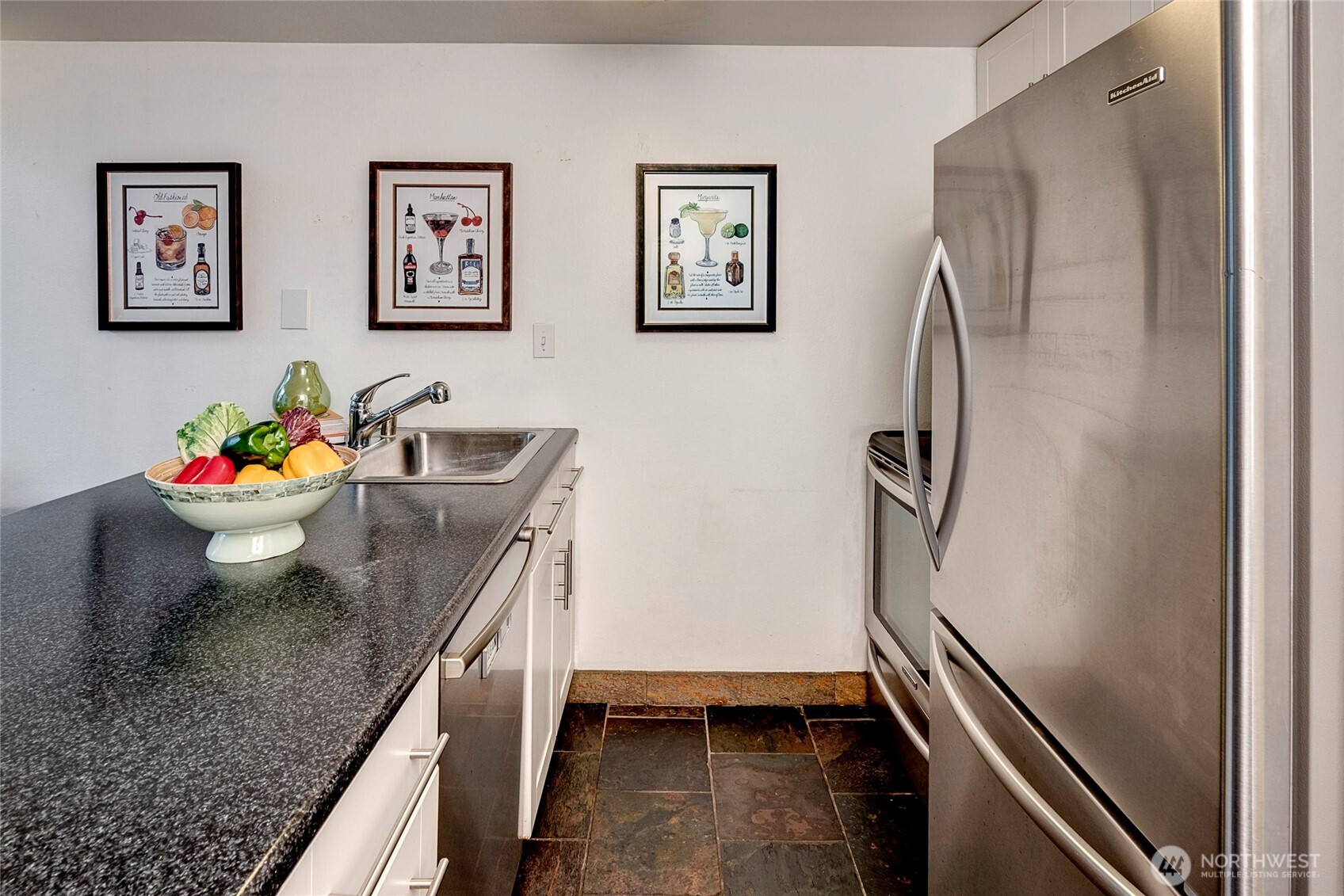 1000 Union Street, Unit 202 Seattle, WA 98101 - Photo 8 of 30 a bathroom with a granite countertop sink and a mirror