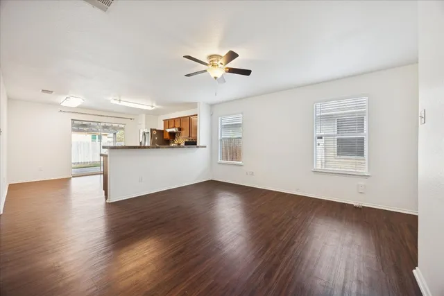 a kitchen with a sink appliances cabinets and a counter top space