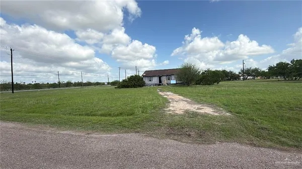 a view of a house with a big yard