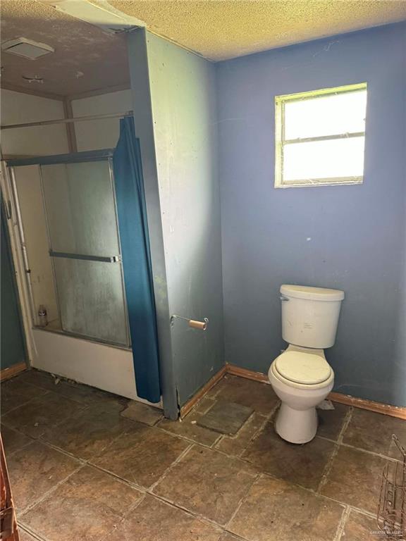 12427 Sasha Drive Santa Rosa, TX 78593 - Photo 11 of 17 a bathroom with a toilet