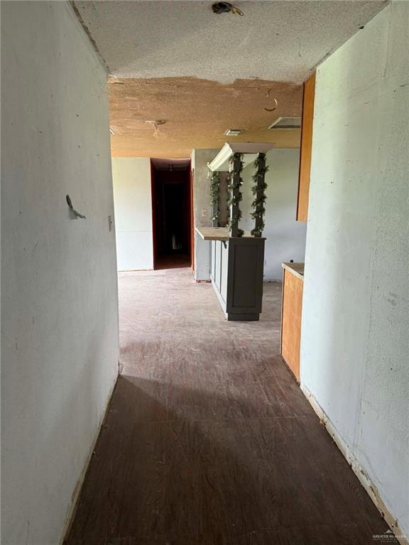12427 Sasha Drive Santa Rosa, TX 78593 - Photo 12 of 17 a view of a hallway with a dining table and chairs