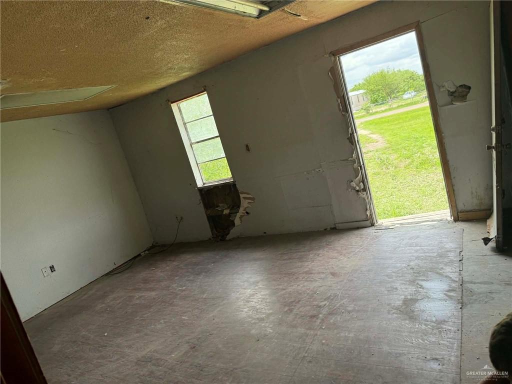 12427 Sasha Drive Santa Rosa, TX 78593 - Photo 13 of 17 a view of an empty room with a window